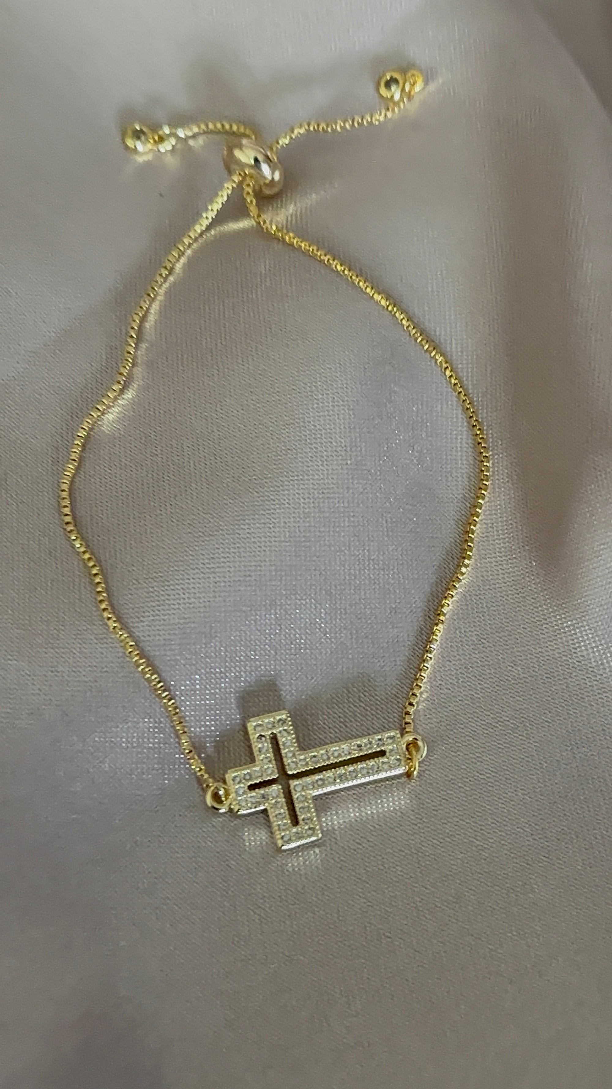 Gold bracelet cross
